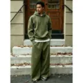 Detailed view of casual fleece-lined hoodie and wide-leg pants set in solid olive green. - Army Green Set