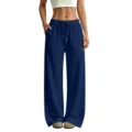 Vista dettagliata di pantaloni della tuta blu scuro a gamba larga con vita alta e coulisse. - Taglia S / Blu navy