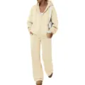 Detail view of beige fleece zip-up hoodie and wide-leg sweatpants set, cozy casual wear. - Beige