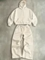 Close-up detail of the beige hooded sweatshirt and wide leg pants lounge set texture. - S / Top And Bottom / Apricot