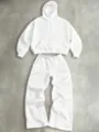 Detailed view of the casual white hoodie and wide-leg sweatpants set, comfortable style. - White