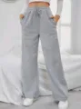 Detail view of casual grey fleece-lined sweatpants for women with comfortable drawstring. - S / Light Gray