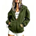 Detail view of army green oversized zip-up hoodie featuring hooded design and front pockets. - Army Green