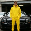 Men's yellow solid fleece hoodie and sweatpants tracksuit set for casual sportswear. - Yellow