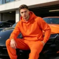 Men's fleece-lined solid color hoodie and sweatpants set in vibrant orange, casual activewear. - Orange
