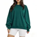 Détail sweat-shirt col rond vert foncé, haut pull manches longues coupe ample style. - Sweat-shirt à col rond vert foncé