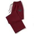 Close-up detail of casual wide-leg sweatpants with drawstring and Boston letter print. - Burgundy
