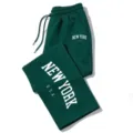 Dark green sweatpants detail showing New York letter print and comfortable drawstring waist. - S / Blue