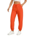 Orange casual drawstring sweatpants detail showing elastic waist and comfortable fabric fit. - Orange