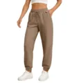 Comfortable khaki sweatpants featuring an adjustable drawstring waist and relaxed cuffed legs. - Camel