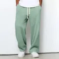 Pantalon décontracté ample en gaufre vert clair vue de détail avec cordon réglable. - Vert clair