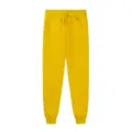 Close-up view of comfortable yellow fleece sweatpants with adjustable drawstring waistband. - Yellow
