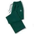 Pantalón de chándal streetwear verde oscuro con estampado de ojos XX, corte ancho y cómodo. - Verde Oscuro