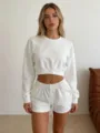 Detail closeup of the solid white casual cropped sweatshirt and drawstring shorts lounge set. - S / White