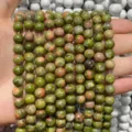Detailed macro view of natural unakite stone round beads for DIY jewelry and bracelets - Unakite