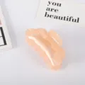 Vista detallada de una elegante pinza para el cabello grande de acetato color melocotón - Rosa Anaranjado