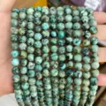 Close-up of round turquoise beads with natural black mineral veins for DIY jewelry - Grade A African Turquoise