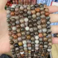Macro shot of natural agate stone beads with diverse patterns for jewelry making - Petrified Wood