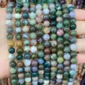 Close-up detail of natural moss agate round beads showing unique green and earthy patterns - Indian Agate