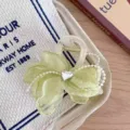 Green fabric flower hair claw clip with crystal heart and pearls, chic summer hair accessory detail. - Green