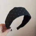 Detailed view of black cloth headband featuring white cross pattern, daily wide hair accessory. - Starry Point Wide Headband / Black