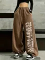 Women's brown fleece-lined loose wide-leg sweatpants with cool slogan print and drawstring. - Coffee
