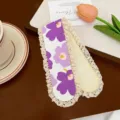 Cute floral knitted bangs sticker detail, featuring purple flowers and delicate lace trim. - Purple Flower