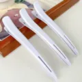 Professional hair sectioning duckbill clips in white, perfect for salon styling and haircuts. - White