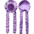 Detail view of long purple satin sleep cap with extra long pleated tails for hair protection. - Purple