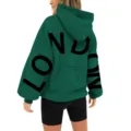 Fashionable women green hooded sweatshirt featuring dropped shoulders and bold back text print. - S / Tops / Green & Black Label