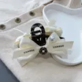 Black and white bow hair claw clip with elegant pearls and camellia flower for daily styling. - White Hair Claw