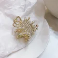 Superbe pince a cheveux metallique avec perles et strass pour coiffures Y2K tendance. - Or