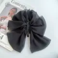 Large black mesh bow hair claw clip, elegant sheer fabric shark hair clip for women styling. - Black