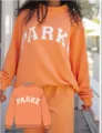 Cozy orange crewneck sweatshirt featuring stylish letter print and comfortable matching lounge pants set. - XS / Top And Bottom / Orange - White Letters