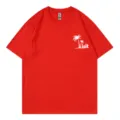 Classic red short sleeve crewneck t-shirt featuring a chic tropical palm tree graphic print. - S / Tops / Red