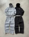 Detailed view of high street zip-up hoodie and matching sweatpants set with fine embroidery. - S / Set / Light Gray