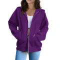 Detail view of the casual purple zip-up hoodie featuring comfortable pockets and adjustable drawstrings. - Purple