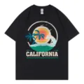 Casual black short-sleeve t-shirt featuring a retro California sunset surfing graphic top. - S / Tops / Black
