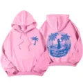 Sweat à capuche rose à manches longues pour femme avec motif graphique de plage et palmiers. - S / Hauts / Rose