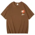 Braunes Damen Kurzarm T-Shirt mit lässigem Hawaii-Palmen- und Sonnen-Motiv für den Sommer. - Kaffeebraun