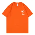 Orangenes Kurzarm-T-Shirt mit weißem tropischen Palmen-Grafikprint, lässiges Design. - Orange