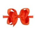 Detailed macro view of a vibrant orange grosgrain ribbon bow headband for baby girls. - Orange Style (31)