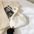 Chic cream white plush underarm bag with soft faux fur texture for winter style - White