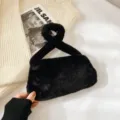 Soft black fuzzy faux fur underarm bag featuring a unique knotted handle design - Black