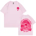 Camiseta rosa de algodón de manga corta con gráfico de surf de olas y estampado de palmas. - Rosa