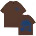 Camiseta de algodón marrón de manga corta con estampado de surf y olas azules - Café