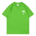 Green short sleeve T-shirt for women featuring a stylish white palm tree print pattern. - S / Tops / Fruit Green 1