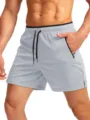 Men's light gray athletic running shorts with zipper pockets and quick dry gym fabric. - S / Bottoms / Light Gray