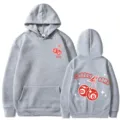 Sweat à capuche gris unisexe tendance avec imprimé graphique cerise bombe et manches longues. - Gris clair