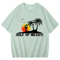 Green cotton short sleeve t-shirt with Gulf of Mexico sunset palm tree graphic print. - S / Tops / Bean Green